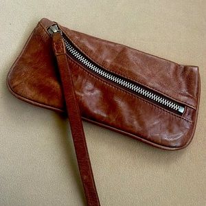 Brown leather wristlet.
